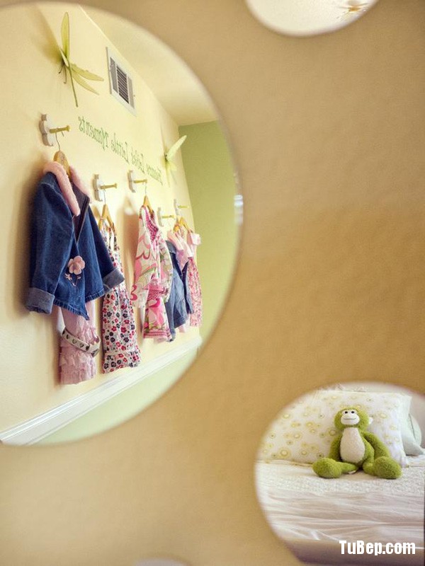 The whimsical round mirrors help open up the rather small room.