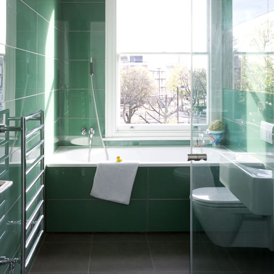 Green bathroom floor to ceiling tiled walls and bath surround real home L etc 02/2009 pub orig